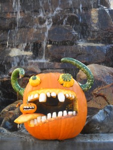 Big mouth pumpkin with horns and crazy eyes. 