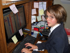 Girl at a desk posing as an artist representative 